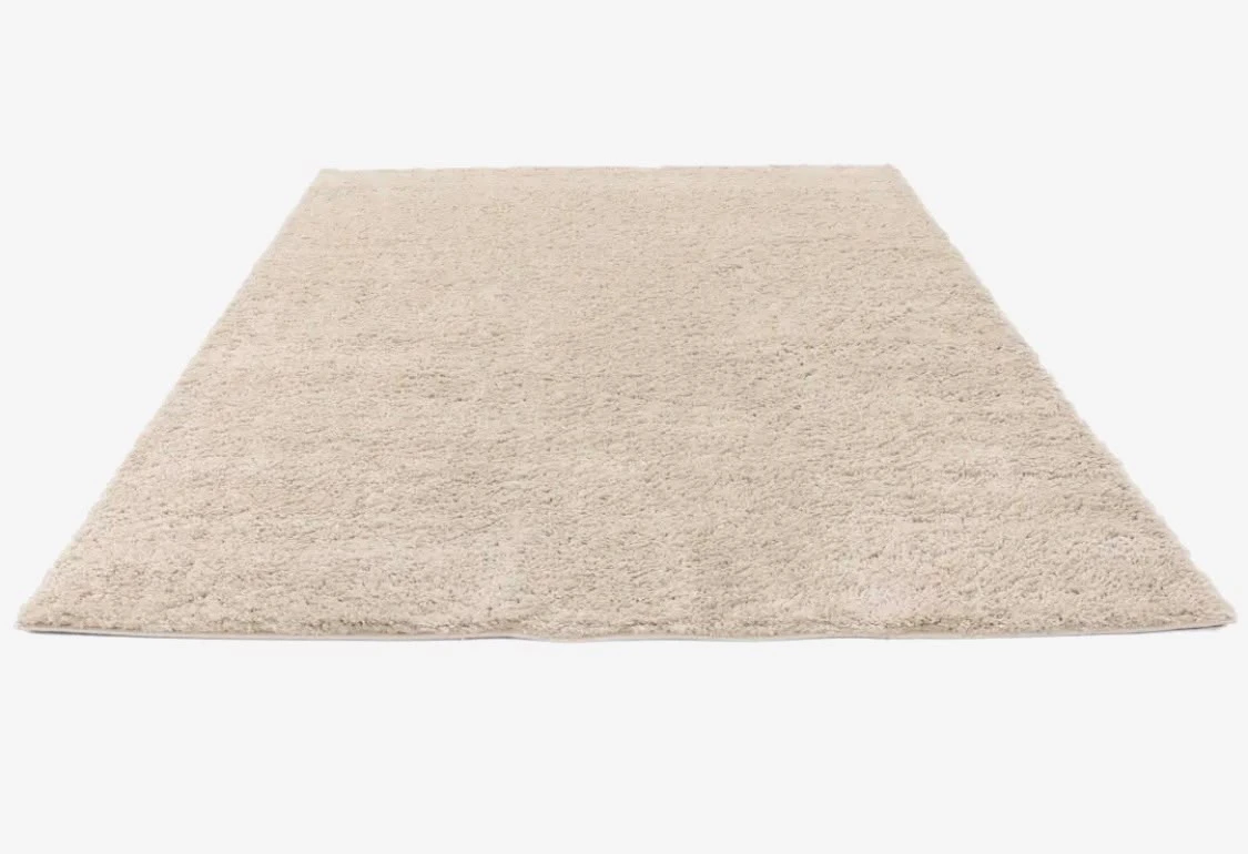 Ivory textured rug reference